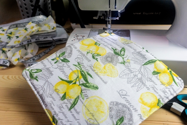 Sewing machine doing a top stitch on a DIY pot holder