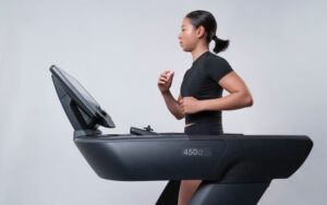 A woman running on a treadmill.